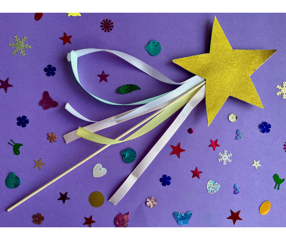 Toverstafje omringt door glitters